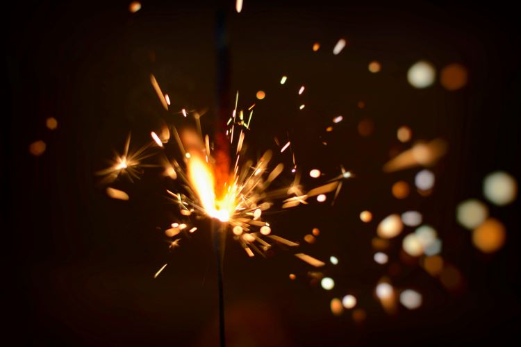 Close up view of sparks from a firecracker used to celebrate the Fourth of July