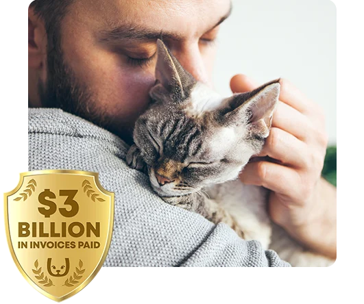 A man snuggling a cat.