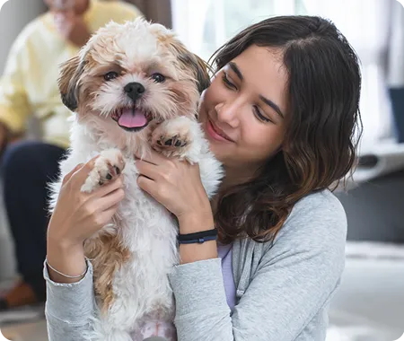 Woman holding a puppy