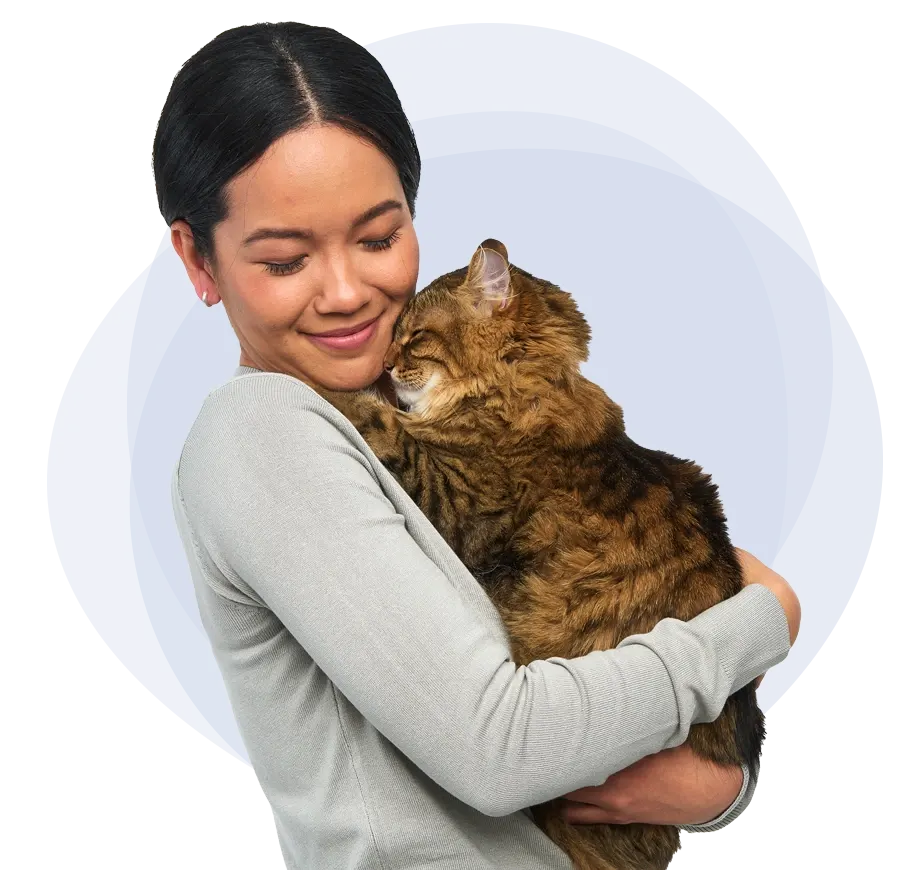Woman snuggling a cat